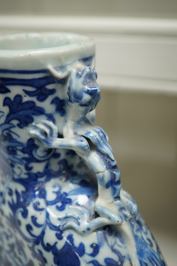 A pair of late 19th century Chinese blue and white moon vases, 23cm. Condition - one vase poor